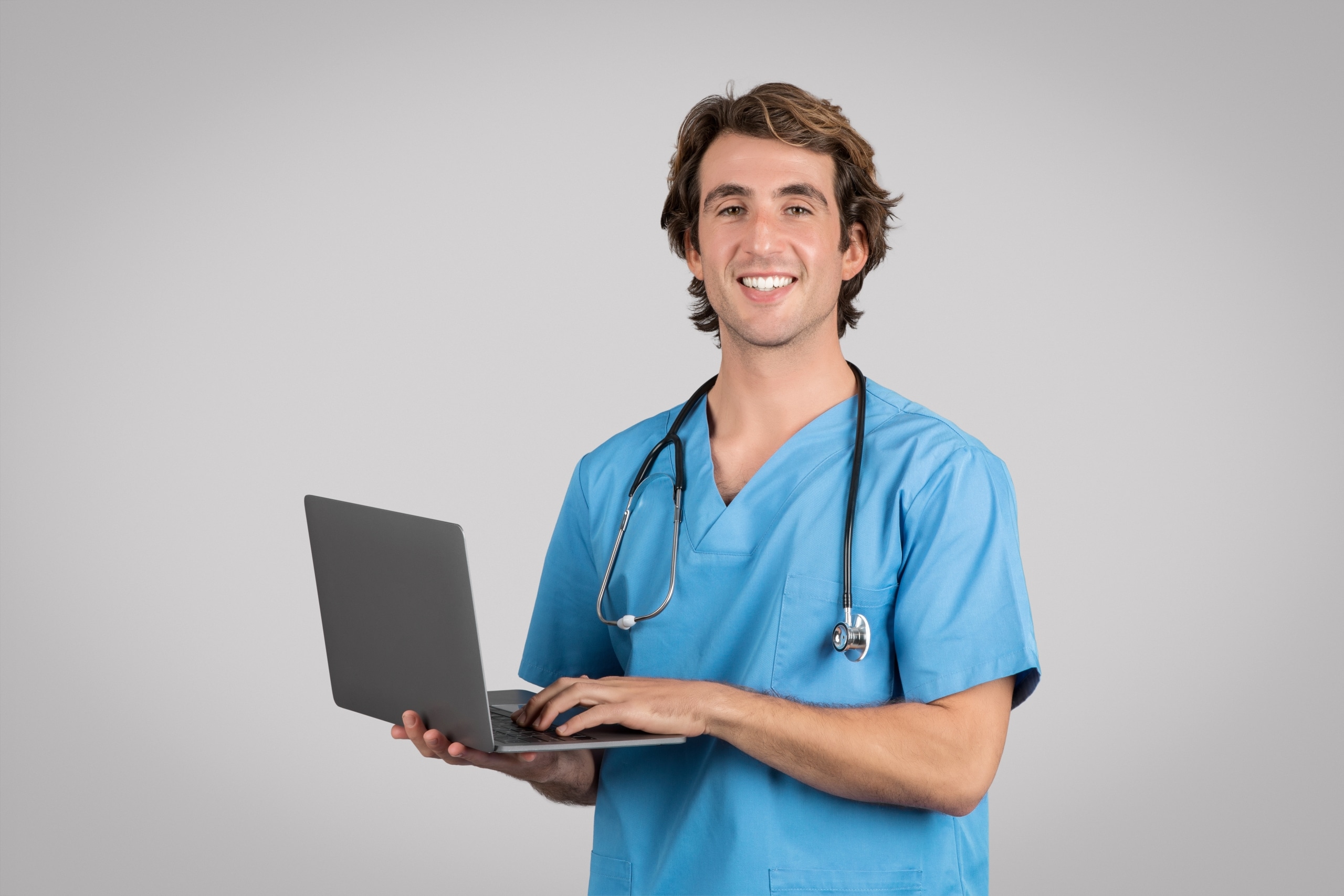Male medical professional using a laptop