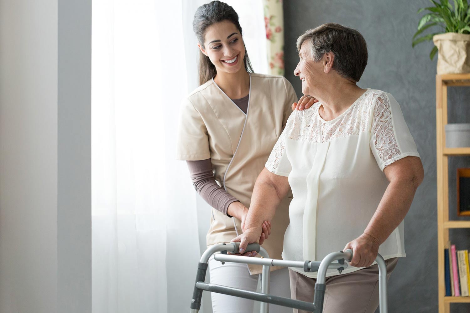 Smiling home health aide with a senior woman