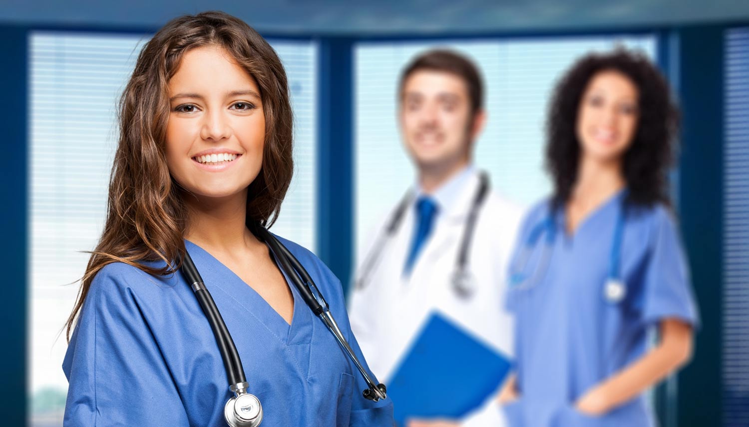 Young nurse in scrubs with a stethoscope