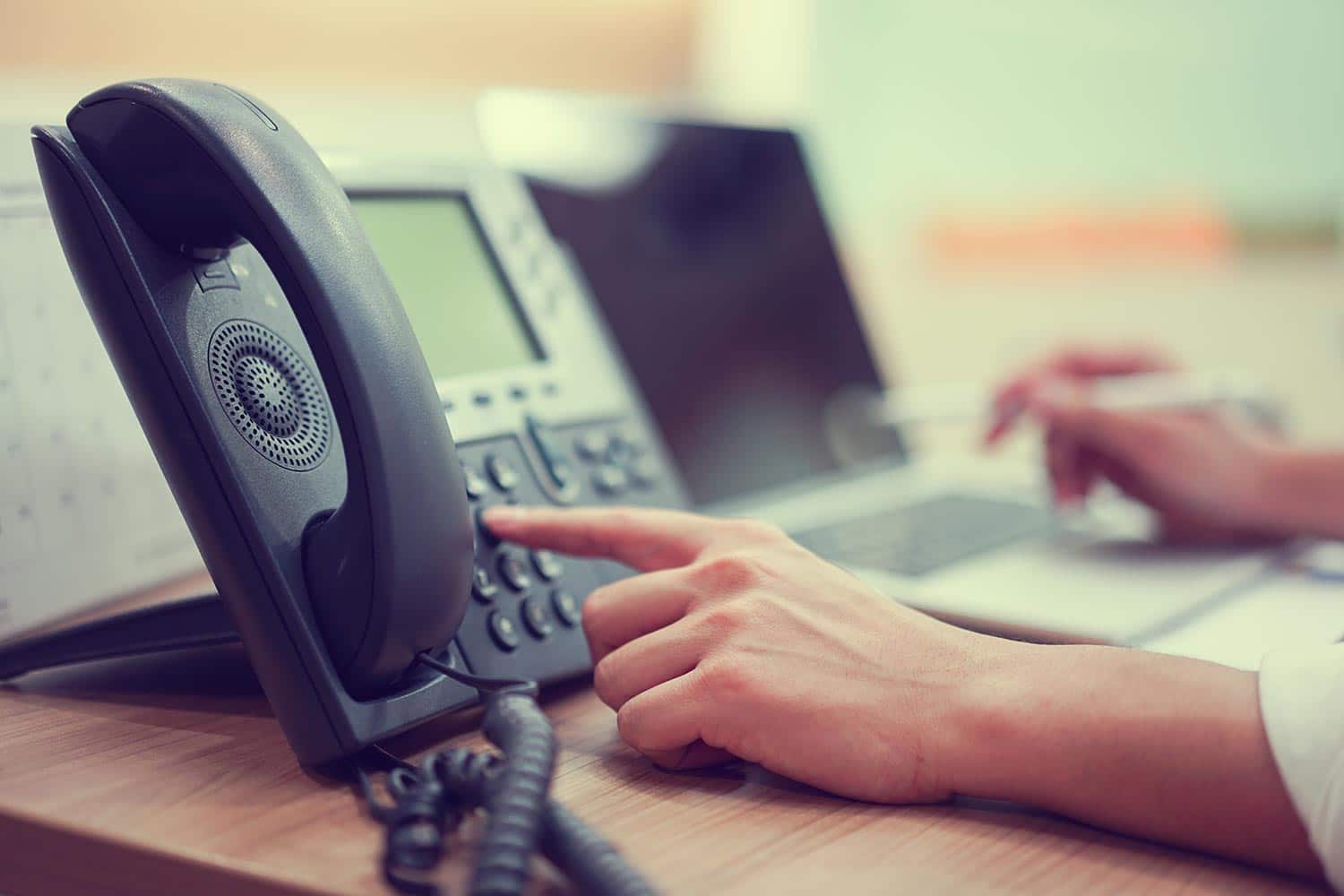 Close up of a medical professional using a telephone