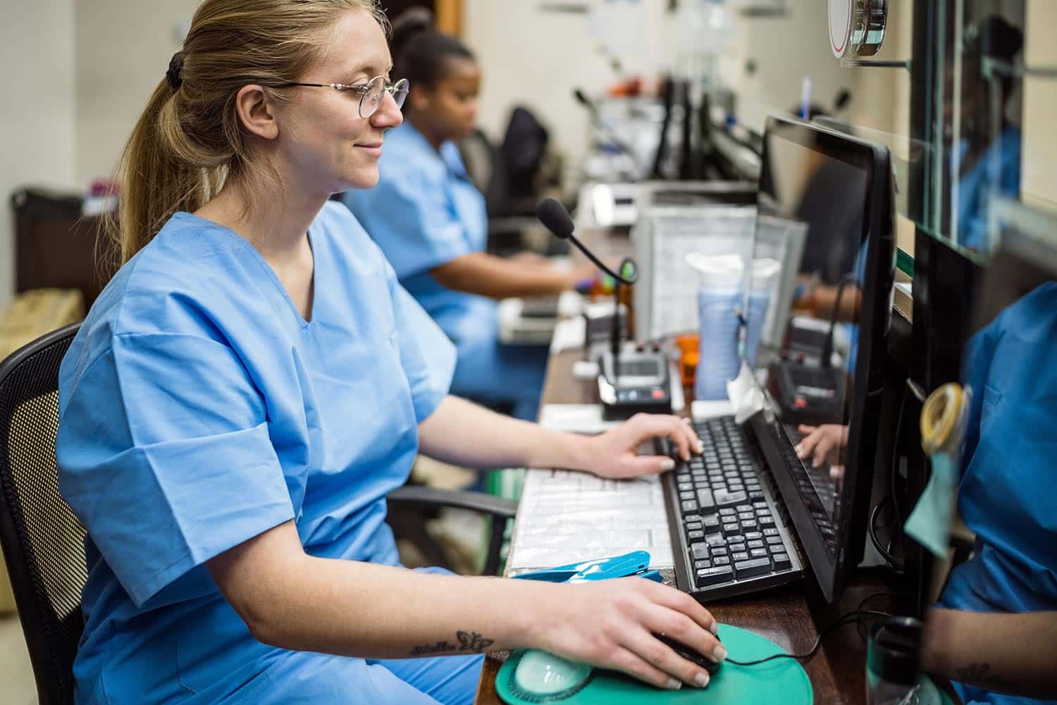Female medical professional using a computer