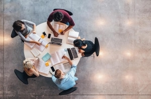Aerial view of medical students studying at a table